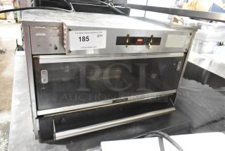 Hatco GRMW-3 stainless steel countertop heated merchandiser, 120 volts, 1 phase. Visible controls, "Caution-Hot" label.