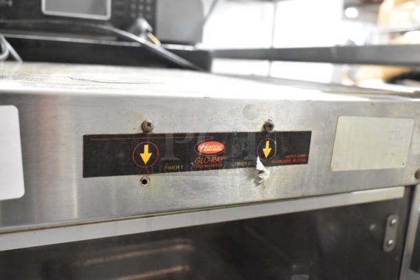 Hatco GRMW-3 stainless steel countertop heated merchandiser. Features Glo-Ray food warmer label, dual timers, 120 volts, 1 phase.