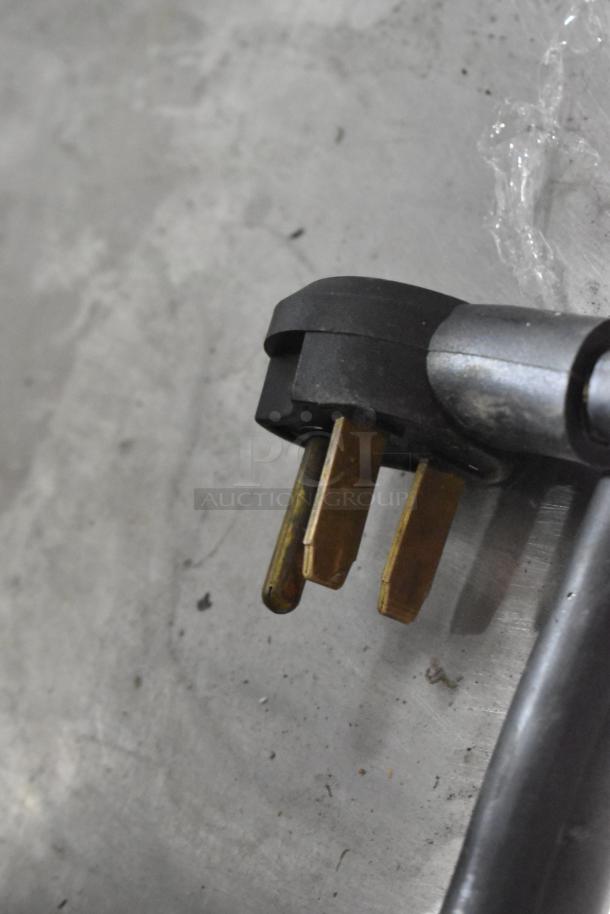 Close-up of Turbochef Encore 2 oven power plug, showing 208/240V, 1 phase connection type.