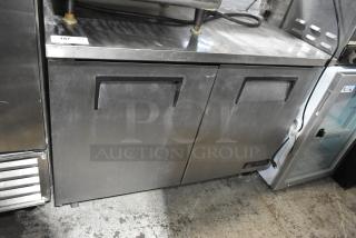 True TUC-48F stainless steel commercial 2-door undercounter freezer with commercial casters, 115V, 1 phase. Some surface wear.