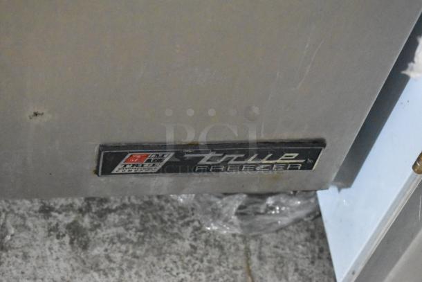 True TUC-48F stainless steel undercounter freezer, 2 doors, commercial casters, 115V, visible True label on front.