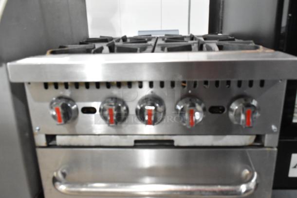 Cooking Performance Group CPG 351S24N stainless steel 4 burner range with oven, natural gas, 150,000 BTU, knobs visible.