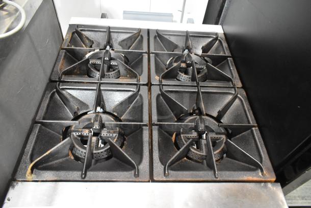 Cooking Performance Group CPG 351S24N stainless steel 4 burner range with oven, natural gas, 150,000 BTU, good condition.