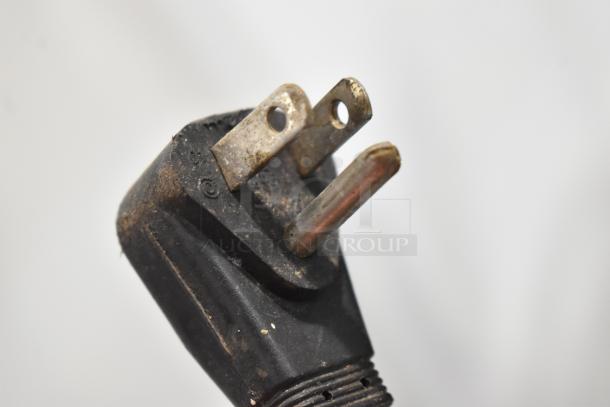 Close-up of a weathered power plug for a 2016 Ice-O-Matic ICEU150GA6 ice machine. Plug shows signs of use.