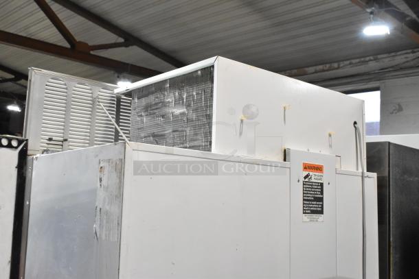 Sub-Zero wood panel 2-door reach-in cooler with freezer, 115 volts, 1 phase. Warning label visible. Slight wear.