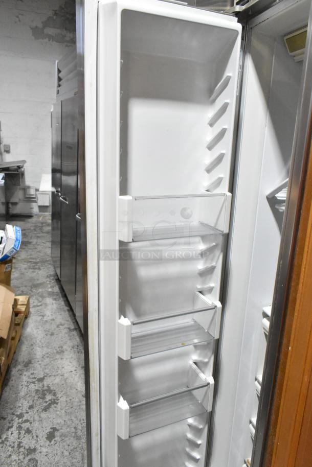 Sub-Zero wood panel 2-door reach-in cooler with freezer, 115 volts, 1 phase, interior view, white shelves, good condition.