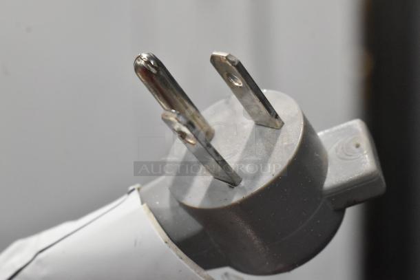 Close-up of standard plug on Sub-Zero wood panel cooler w/ freezer, 115 volts, 1 phase.