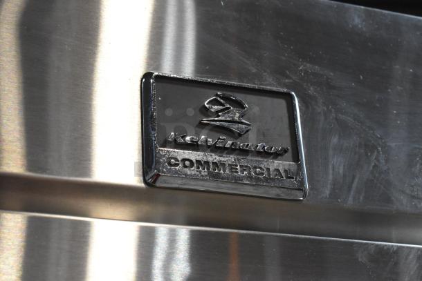Kelvinator KCBM23R stainless steel commercial reach-in cooler with visible logo. 115 volts, single phase.