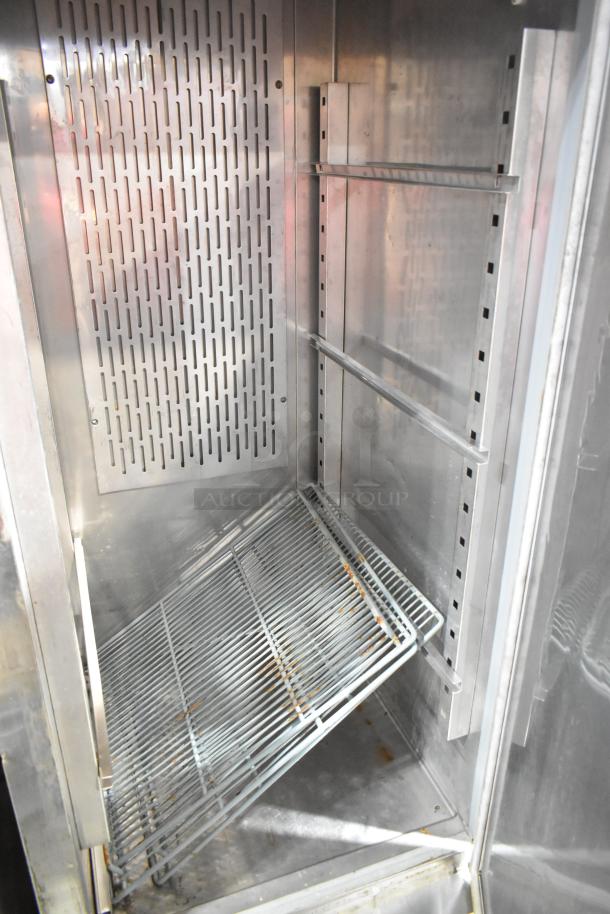 Kelvinator KCBM23R stainless steel commercial cooler, single door, interior view showing shelving and clean condition.