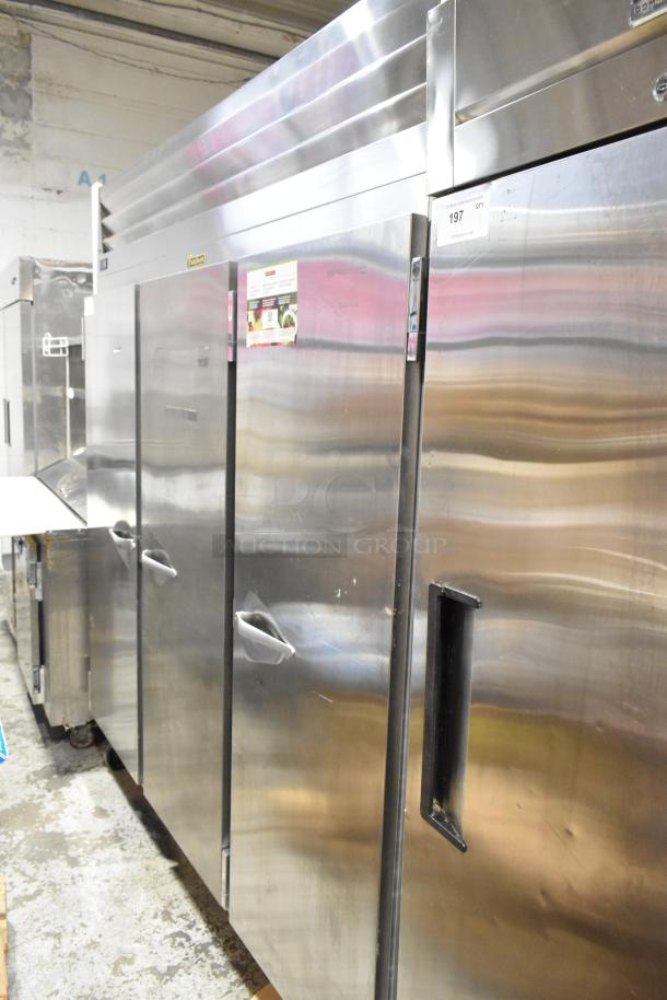2018 Traulsen G31010 stainless steel commercial 3-door reach-in cooler with poly coated racks, 115 volts, 1 phase.