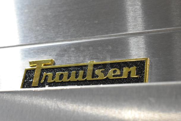 2018 Traulsen G31010 stainless steel logo on commercial 3-door cooler.