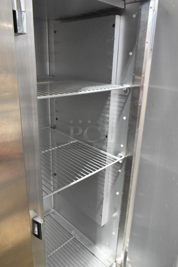 2018 Traulsen G31010 stainless steel 3-door reach-in cooler, poly-coated racks, 115V, 1-phase, excellent condition.