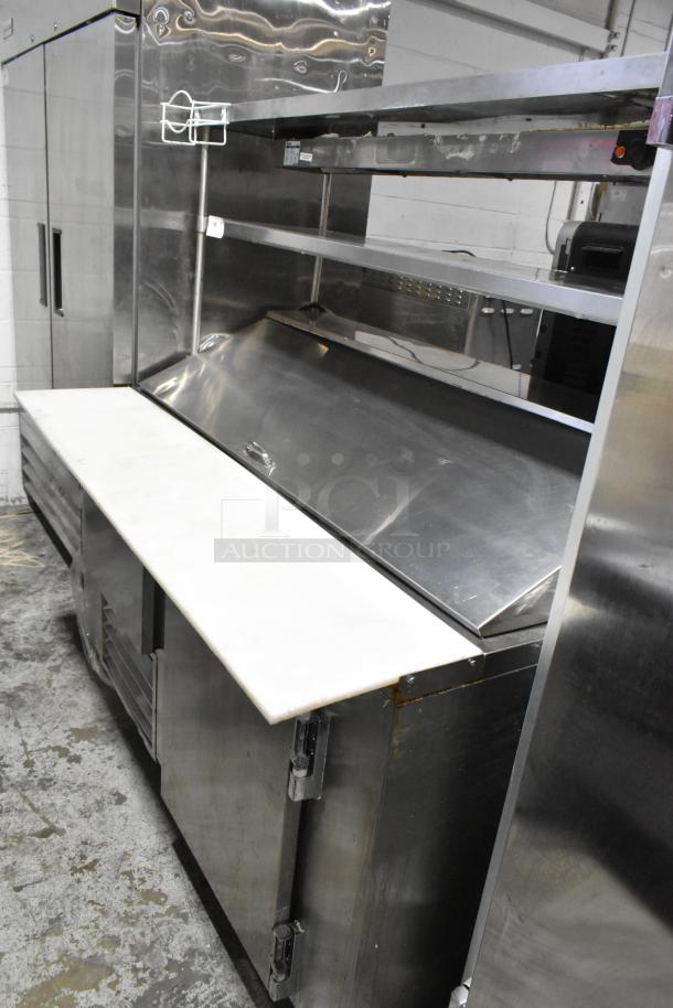 2020 Leader NLM60 stainless steel sandwich prep table, 2-tier overshelf, food warming strip, on commercial casters.