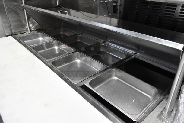 2020 Leader NLM60 stainless steel prep table with bain marie top, 2-tier overshelf, warming strip, and commercial casters.