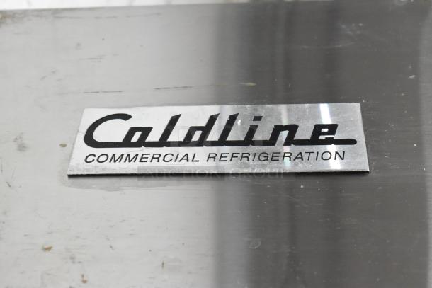 Coldline CFD-2RR-E-HC stainless steel cooler badge. Model name and "Commercial Refrigeration" text visible.