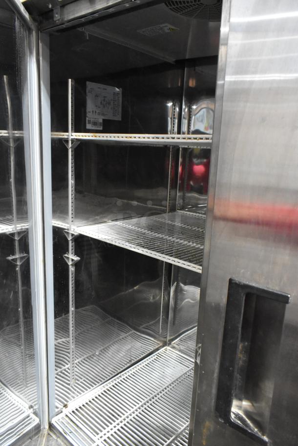 Coldline CFD-2RR-E-HC stainless steel 2-door reach-in cooler, poly coated racks, on commercial casters, 115V, 1 phase.