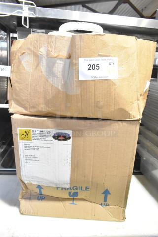 Two sealed boxes from Hi-Lite Mfg. Co. labeled fragile; condition noted as scratch and dent. Includes orange fixture and hose.