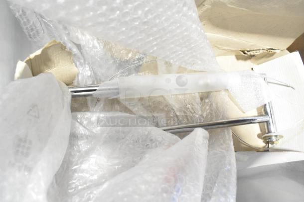 Lot of various items including poly bins and containers, wrapped in bubble wrap, with visible cardboard and metal rod.