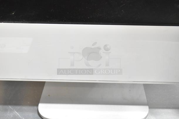 Apple iMac All In One Computer, silver finish, Apple logo visible, moderate wear, no visible accessories or specifications.