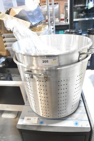 Stainless steel straining pot with handles, new condition, labeled "208 QTY 5," part of auction lot including other kitchenware.