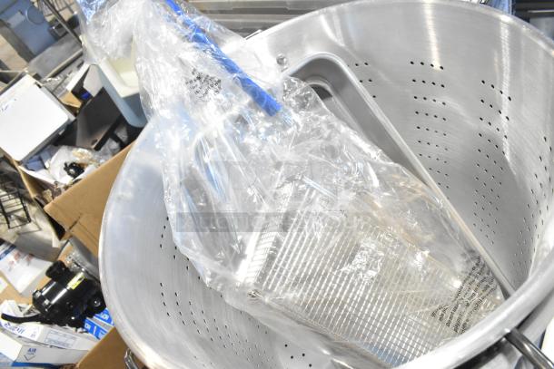 5 brand new scratch and dent items, including a Vollrath 68366 roasting pan with handles, straining pots, a fry basket, and a mixer whisk attachment.