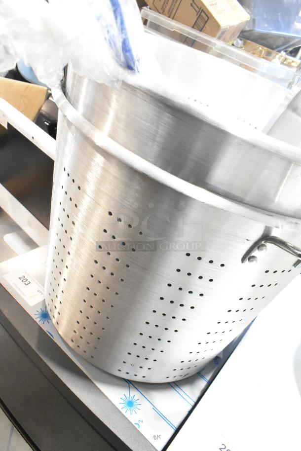 5 brand new scratch and dent kitchen items, including Vollrath aluminum roasting pan, straining pots, fry basket.