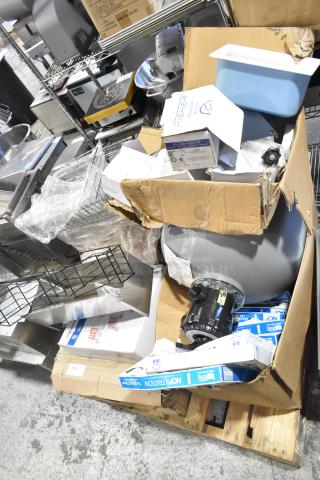 Pallet with exit signs, metal baskets, grease filters, pink butcher paper, Fisher faucet handles, couplers, and tank.