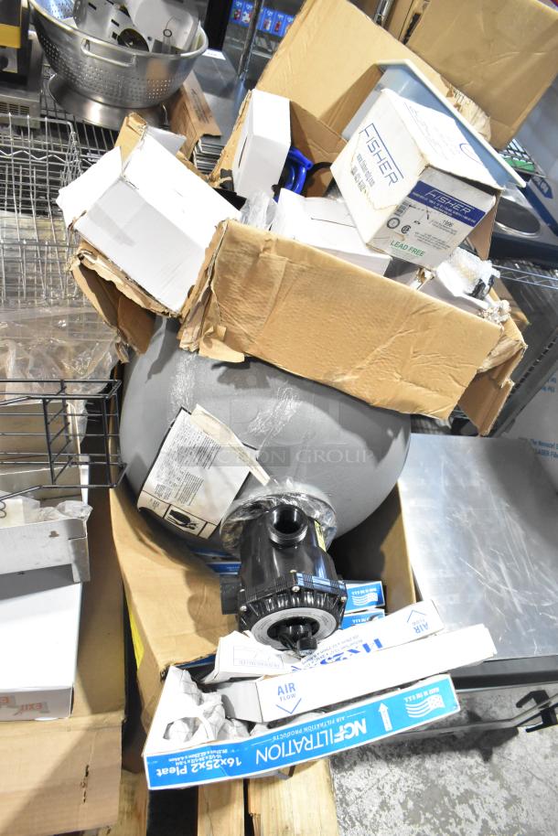 Pallet of mixed items including exit signs, metal baskets, grease filters, butcher paper, Fisher faucet handles, filters, tank.