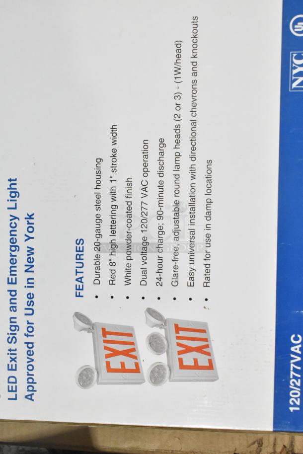 Box of LED exit signs with emergency lights, dual voltage 120/277 VAC, white powder-coated finish, rated for damp locations.