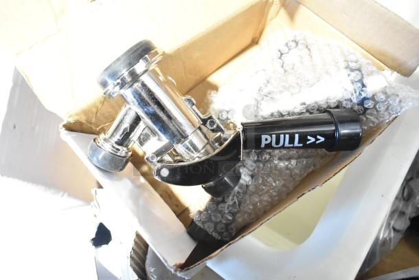 Pallet lot with coupler in box, labeled "PULL." Includes exit signs, metal baskets, filters, butcher paper, faucet handles.