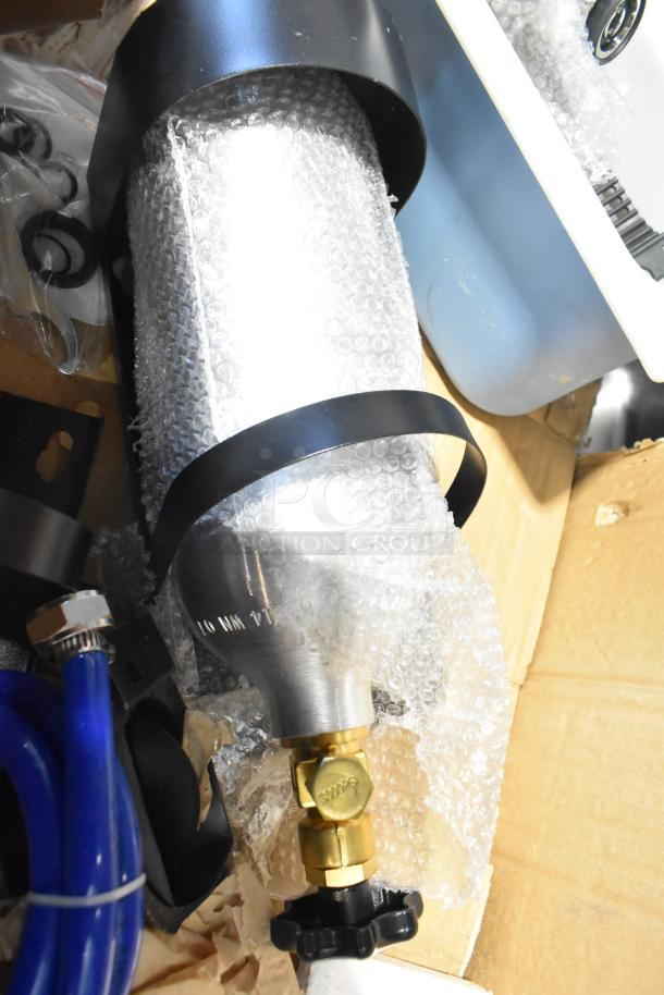 Pallet lot with wrapped filters, faucet parts, hoses; includes Choice 43318PEA butcher paper and exit signs.