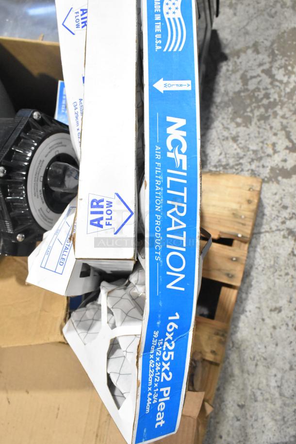 Pallet of various items including NC Filtration air filters, metal grease filters, and components. Boxes marked with "Air Flow".