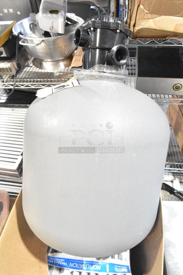 Pallet lot with various items including exit signs, metal baskets, filters, butcher paper, faucet handles, and tank.