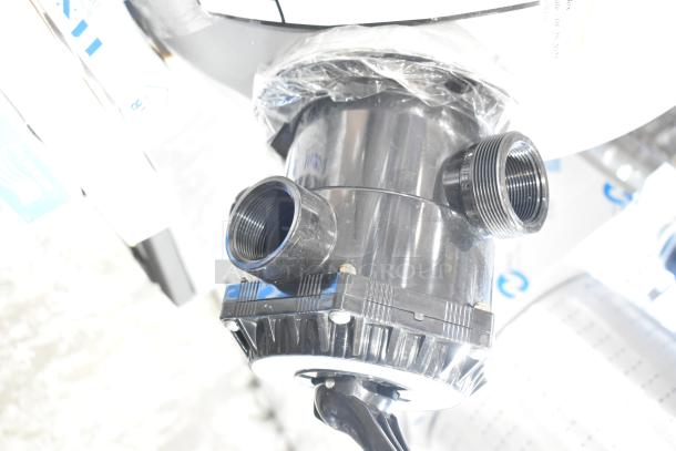 Pallet lot with various items, including exit signs, metal baskets, grease filters, butcher paper roll, faucet handles, coupler, tank.