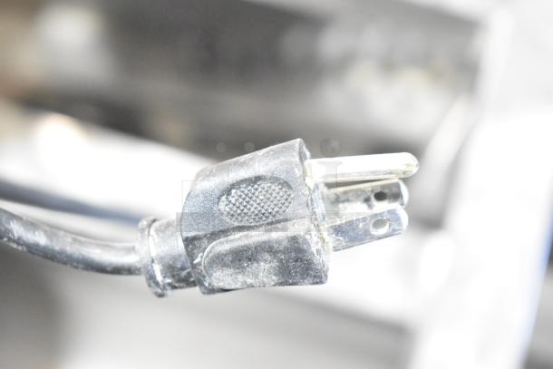 Power plug for AyrKing BBS-U Breading Station, 115/230 Volts, 1 Phase, showing slight wear on black connector.
