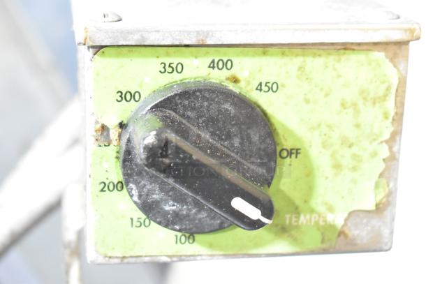 Temperature dial of a Stainless Steel Commercial Braising Pan, showing temperatures from 100 to 450 degrees. Slightly worn condition.