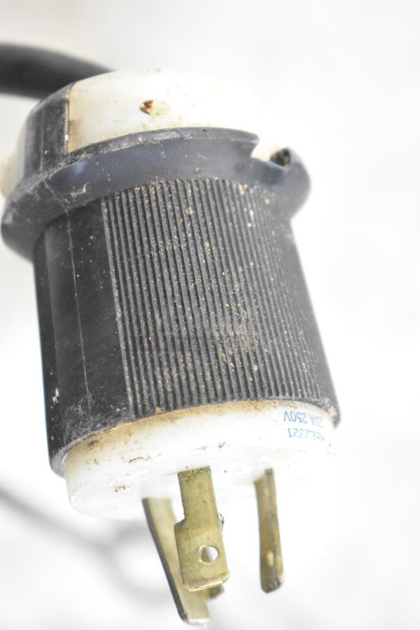 Close-up of a power plug from a 2019 Turbochef ECO stainless steel countertop rapid cook oven, 208/240 volts, 1 phase, showing visible dirt and wear.