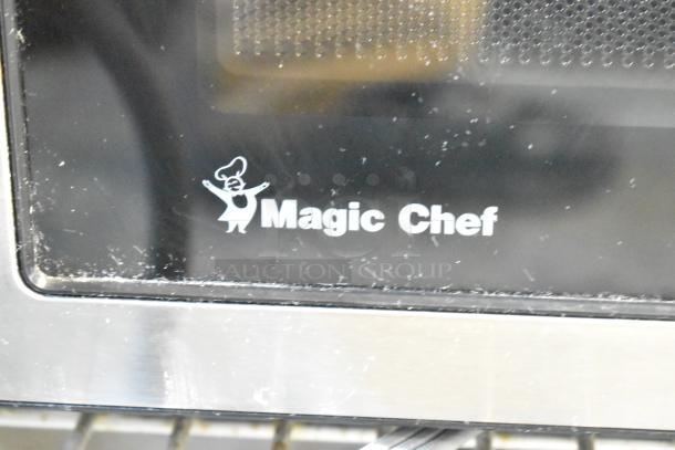 Magic Chef MC110MST countertop microwave oven with plate. Metal finish, 120 volts, 1 phase. Model logo on door.