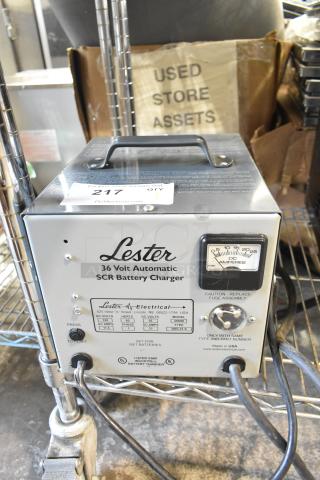 Lester 36 Volt Automatic SCR Battery Charger, model 25900. Features a control gauge, reset button, and power cables.