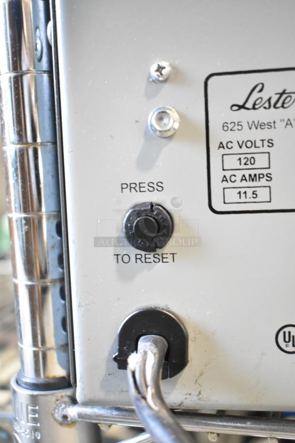 Lester 36 Volt Automatic SCR Battery Charger with reset button and voltage/amperage label, showing 120 AC volts, 11.5 AC amps.