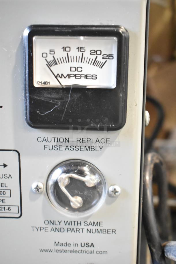 Lester 36 Volt Automatic SCR Battery Charger, features DC ammeter, caution label, made in USA, fuse assembly instructions.