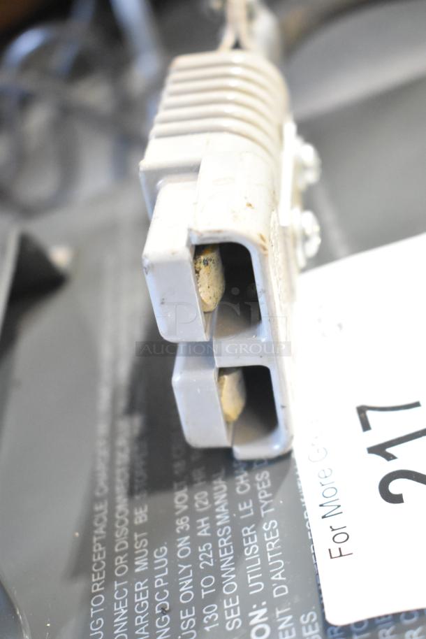 Lester 36 Volt Automatic SCR Battery Charger, showing power connector and label with usage instructions.