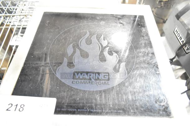 Waring WIH400 stainless steel induction range, countertop single burner. Features Waring logo on surface. 120V, 1 phase.