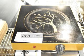 Metal countertop single burner induction range with decorative tree design, dial control, and auction tag number 220.