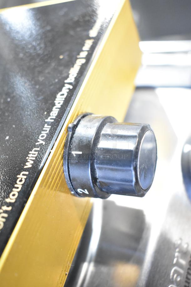 "Metal Countertop Single Burner Induction Range, black knob with numbered settings, visible warning label, excellent condition."