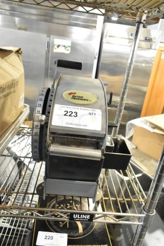 Better Packages 333 Plus manual water-activated tape dispenser on shelf, model BP333Plus, with brand logo and auction tag visible.