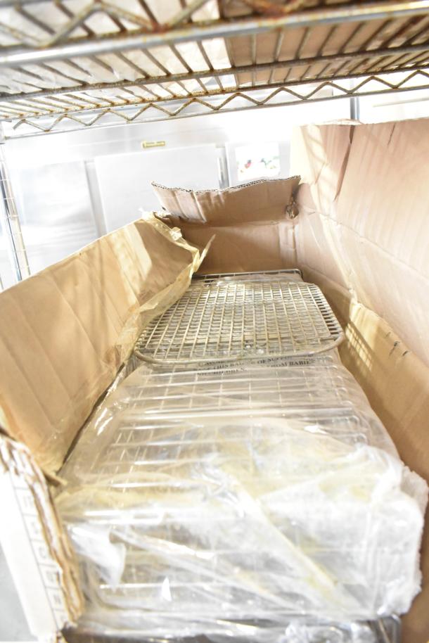 Box containing brand new 3-sided half-long baskets, visible through partially opened packaging, indicating unused condition.