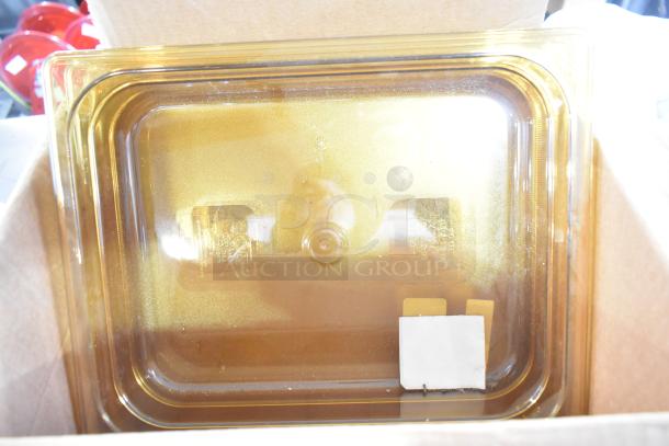Amber Rubbermaid drop-in bins in box; includes cables, brackets; good condition; versatile storage solution.