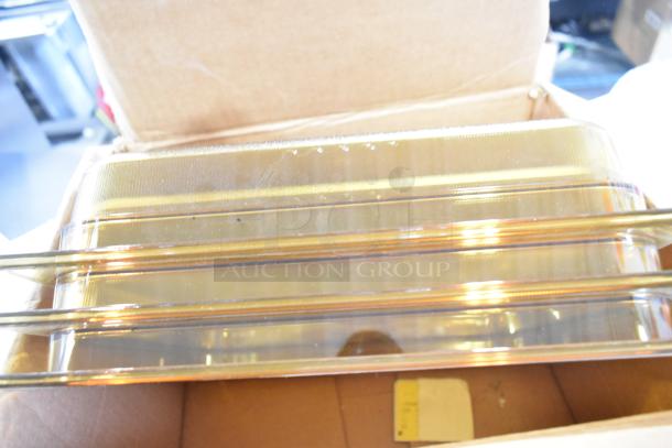 Rubbermaid amber drop-in bins, tiered in a cardboard box, visible cables, and brackets, unused condition.