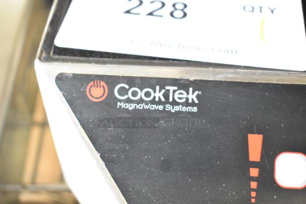 CookTek MC1800 induction range logo close-up, showing "CookTek MagnaWave Systems" text. Stainless steel finish, 120V, 1 phase.